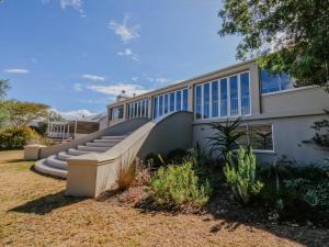 a house with a staircase in front of it at Breede340 - Living the Breede in Malgas