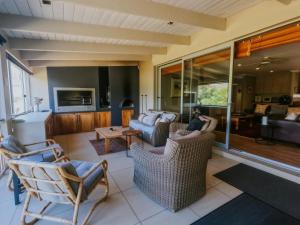 a living room with two couches and a table at Breede340 - Living the Breede in Malgas