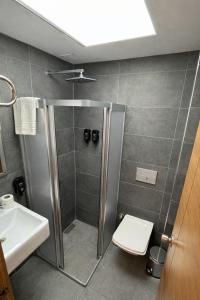 a bathroom with a shower with a toilet and a sink at Ramona Lara in Antalya +14 photos