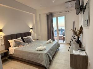 a bedroom with a bed with two towels on it at Escape Rooms in Himare +74 photos