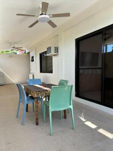 a dining room with a table and chairs at The San Juan House in san juan la union