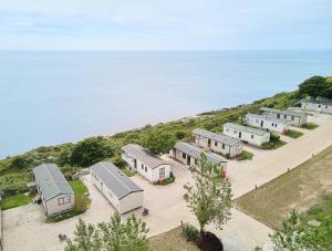 an overhead view of a row of houses on a hill next to the water at Lower Cliff 10 in Portland