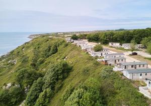 a row of houses on a hill next to the ocean at Lower Cliff 10 in Portland +2 photos