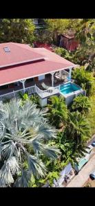 an aerial view of a house with a swimming pool at Creole Paradise beach wifi in Terre-de-Haut