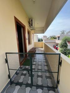 a balcony with a view of a building at Geetham Homestay in Tiruchirappalli