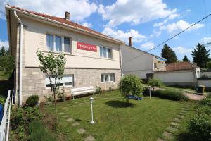 a building with a garden in front of it at Vincze Villa Vendégház in Bükkszék +20 photos