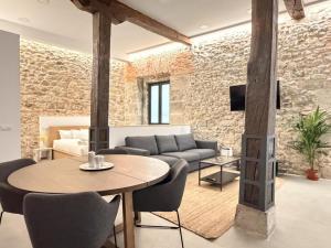 a living room with a couch and a table at Apartamento Calle Limón in Santander