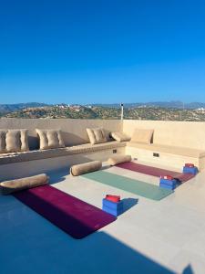 a rendering of a living room with a couch at Dar Youba, Luxe Villa Taghazout in Taghazout