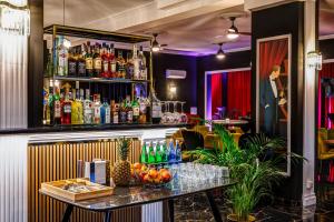 a bar with a table with drinks on it at Hotel Południk Park Conference&SPA in Stargard