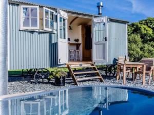 a tiny house with a pool in front of it at 1 Bed in Boscastle oc-84015 in Boscastle +15 photos