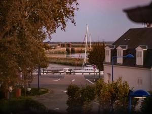 a view of a marina with a boat in the water at Baie Marine in Le Crotoy