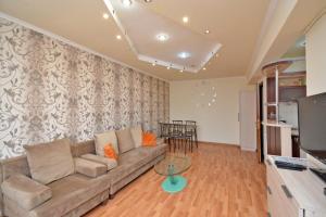 a living room with a couch and a table at Apartment On Saryan Street in Yerevan