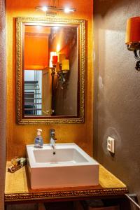 a bathroom with a white sink and a mirror at Guest H4U - Nature & Pool Guarda in Seixo Amarelo