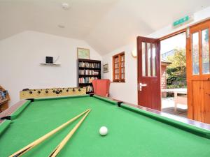 a room with a pool table and a book shelf at 2 Bed in Fowey oc-55381 in Golant