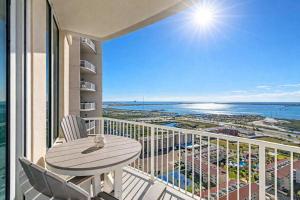 a balcony with a table and chairs and the ocean at Sapphire Beach - Breathtaking 26th Floor Views in South Padre Island