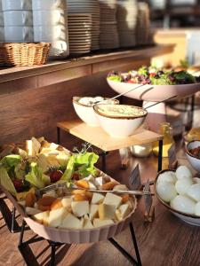 a buffet with several different types of food on display at Hotel Swing in Krakow