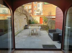 a view of a patio with a table and chairs at Spacious Design Home with Garden near Centre in Bruges