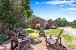 a group of chairs sitting around a fire pit at Terlingua at the Bend in Wimberley