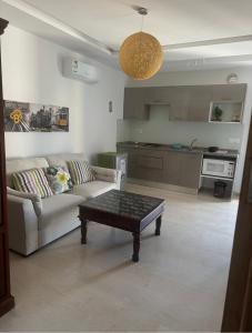a living room with a couch and a coffee table at DIAR Soufa in Chott Meriem