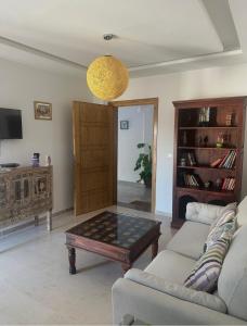 a living room with a couch and a coffee table at DIAR Soufa in Chott Meriem