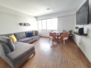 a living room with a couch and a table at Habitación en departamento Compartido - La Paz 504 in Lima