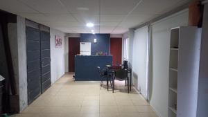 a hallway with a table and chairs in a room at Uritorco Flats in Capilla del Monte