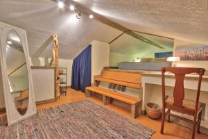 a bedroom with a bed and a table and a mirror at Sunflower Ridge Cabin in San Marcos
