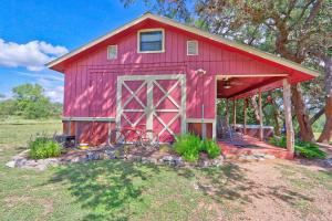 a red barn with a bike parked outside of it at Sunflower Ridge Cabin in San Marcos +13 photos
