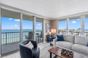 a living room with a view of the ocean at Tristan Towers Unit 10E in Pensacola Beach