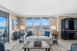 a living room with a couch and a table at Tristan Towers Unit 10E in Pensacola Beach +45 photos