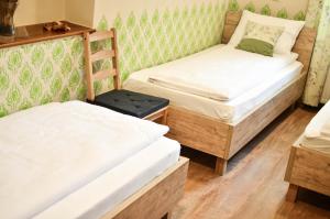 Postel nebo postele na pokoji v ubytování Páva Apartmanház