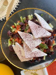 a bowl of food with star shaped crackers on it at Sunset Home - Netanya Roof & Sea View in Netanya