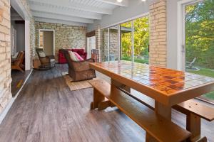 a dining room with a wooden table and chairs at Stone River Cabin in Canyon Lake