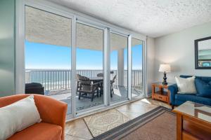 a living room with a view of the ocean at Romar Tower Unit 9D in Orange Beach