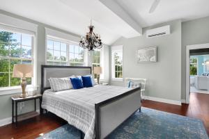 a bedroom with a large bed with blue pillows at Stone Ridge Retreat in Canyon Lake