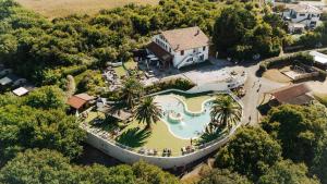 an aerial view of a house with a swimming pool at Camping Erreka in Bidart