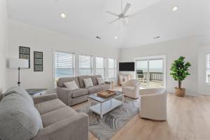 a living room with a couch and a table at 7029 - Just Breathe in Rodanthe
