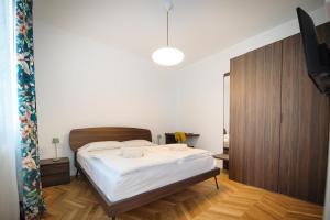 a bedroom with a bed and a television in it at Me amìa in Dolo