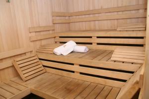 a sauna with two white towels sitting in it at Hotel Kristel Park - All Inclusive Light in Kranevo