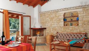 a living room with a couch and a fireplace at Villa Adrianna in Longós