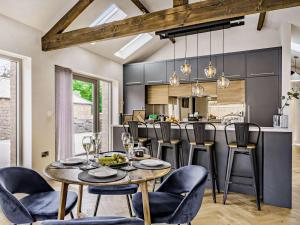 a kitchen and dining room with a table and chairs at 2 Bed in Driffield oc-88238 in Lund