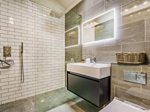 a bathroom with a white sink and a mirror at 2 Bed in Driffield oc-88238 in Lund +27 photos