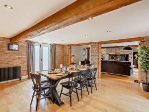 a dining room with a long table and chairs at 3 Bed in Driffield oc-92697 in Lund +26 photos