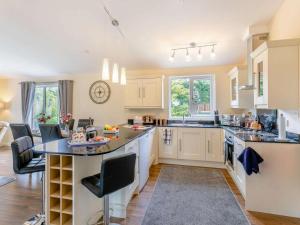 a kitchen with white cabinets and a large island at 2 Bed in Malton oc-87936 in West Heslerton