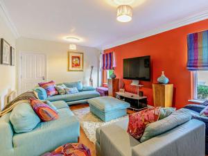 a living room with two couches and a flat screen tv at 4 Bed in Bognor Regis oc-81446 in Bognor Regis