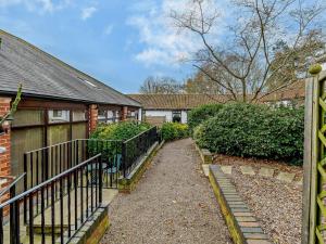 a house with a gate and a walkway at 1 Bed in Doncaster oc-93769 in Mattersey