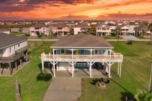 an aerial view of a house in a residential neighborhood at 4BR Near the BeachFire PitFamily Friendly Stay in Bolivar Peninsula