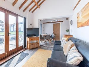 a living room with a couch and a table at 3 Bed in Doncaster oc-93570 in Mattersey
