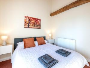 a bedroom with a bed with two pillows on it at 3 Bed in Doncaster oc-93570 in Mattersey