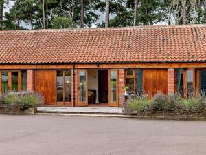 a small building with an orange roof at 1 Bed in Doncaster oc-93572 in Mattersey